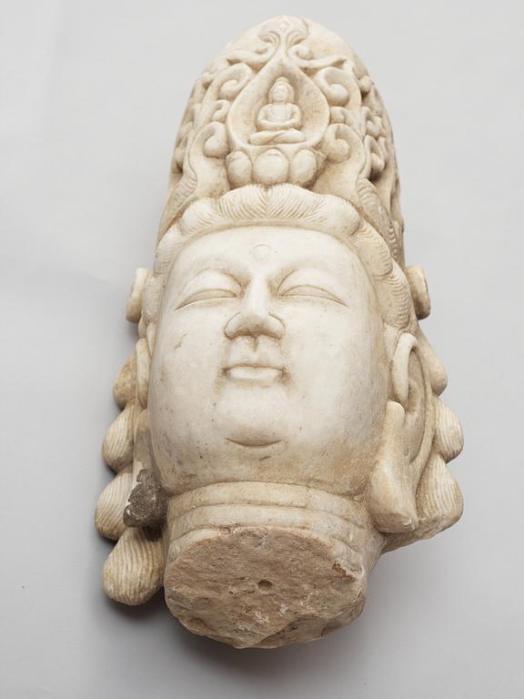 A white stone 20th century buddha head.