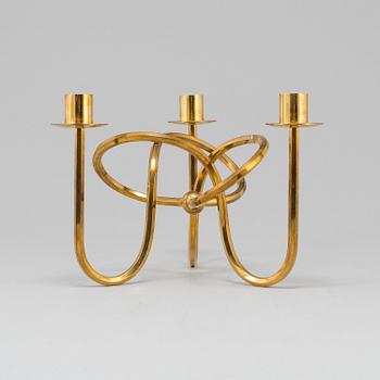 JOSEF FRANK, ljusstake, mässing ”Vänskapsknuten”, Firma Svenskt Tenn, 1900-tal.