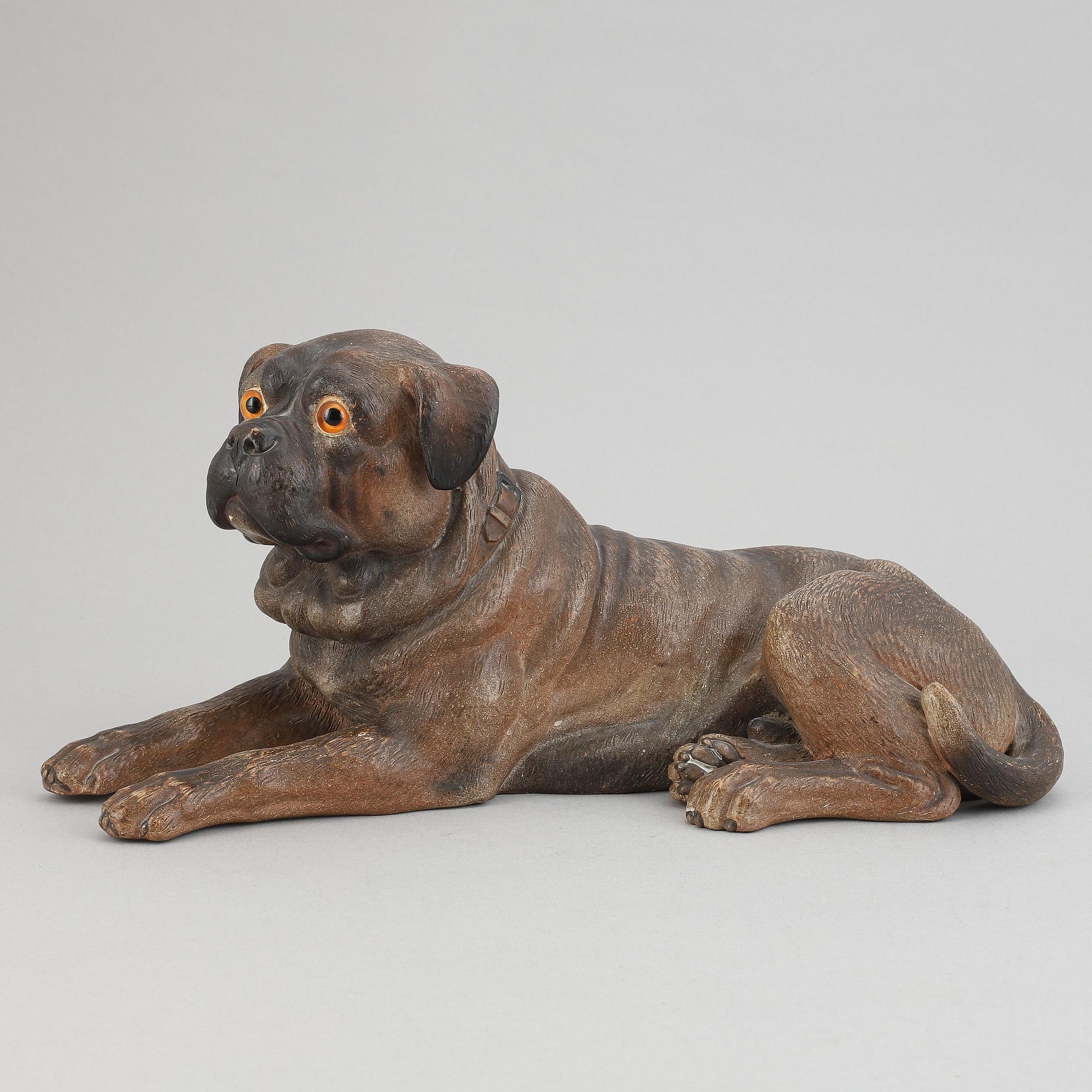 A ceramic sculpture in the shape of a dog, 20th century.