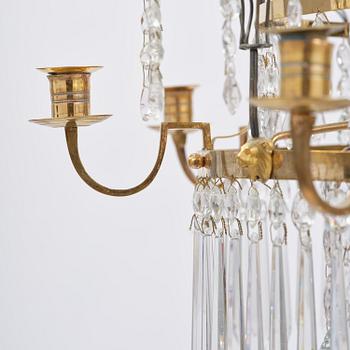 A late Gustavian gilt brass and cut glass eight-branch chandelier, Stockholm, late 18th century.