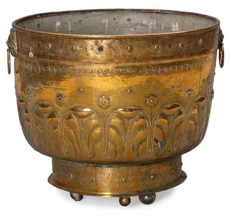 A baroque style brass basin.