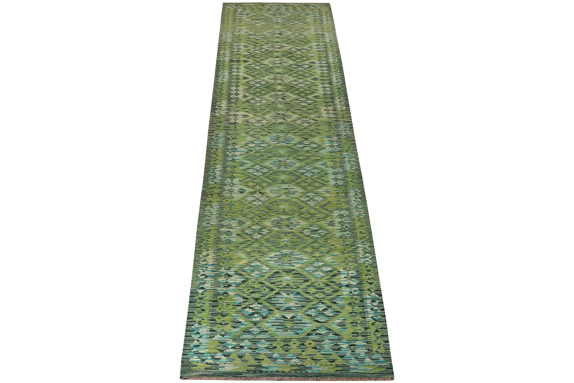 An Afghan kilim runner, c. 488 x 79 cm.