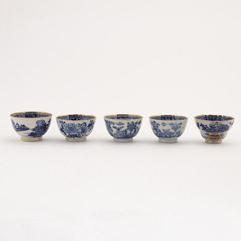 A set of nine gilt and blue and white cups with saucers, Qing dynasty, Qianlong (1736-95).