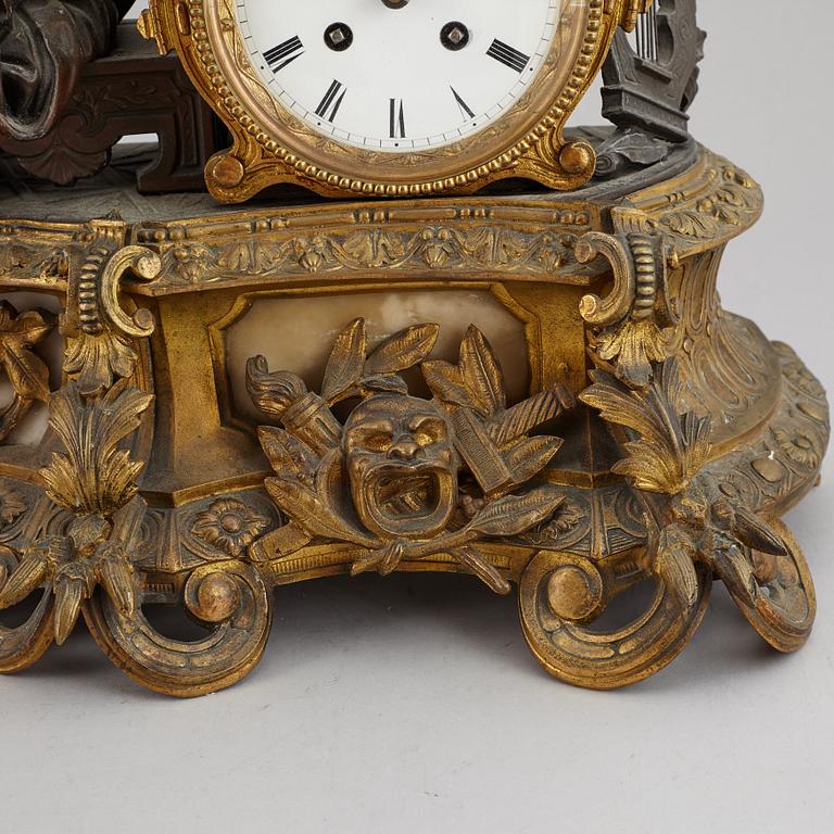 A large bronze mantle clock, circa 1900.