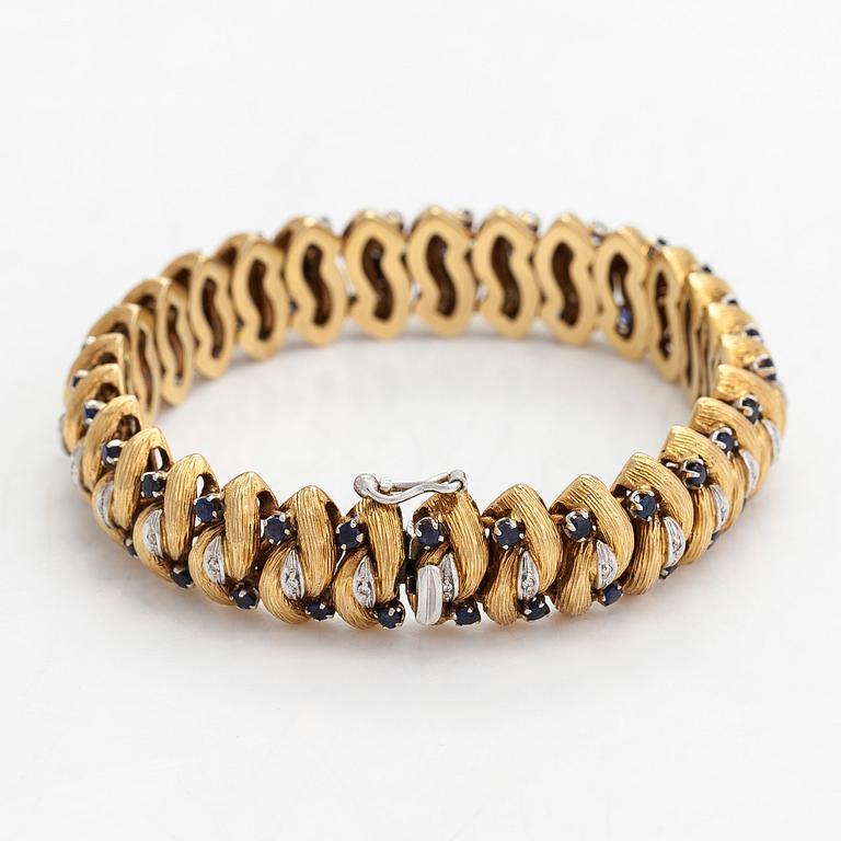 An 18K gold bracelet, diamonds approx. 0.14 ct in total and sapphires, Italy. Finnish import marks.