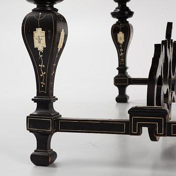 A Renaissance-style ebony, ebonized and ivory-inlaid library table, late 19th century, presumably Germany.