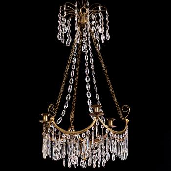 A Gustavian gilt brass and cut glass four-light chandelier, Stockholm, late 18th century.