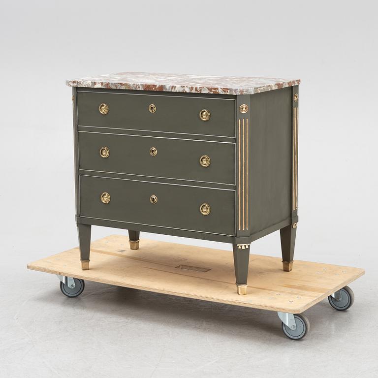 A Gustavian style chest of drawers, mid 20th Century.