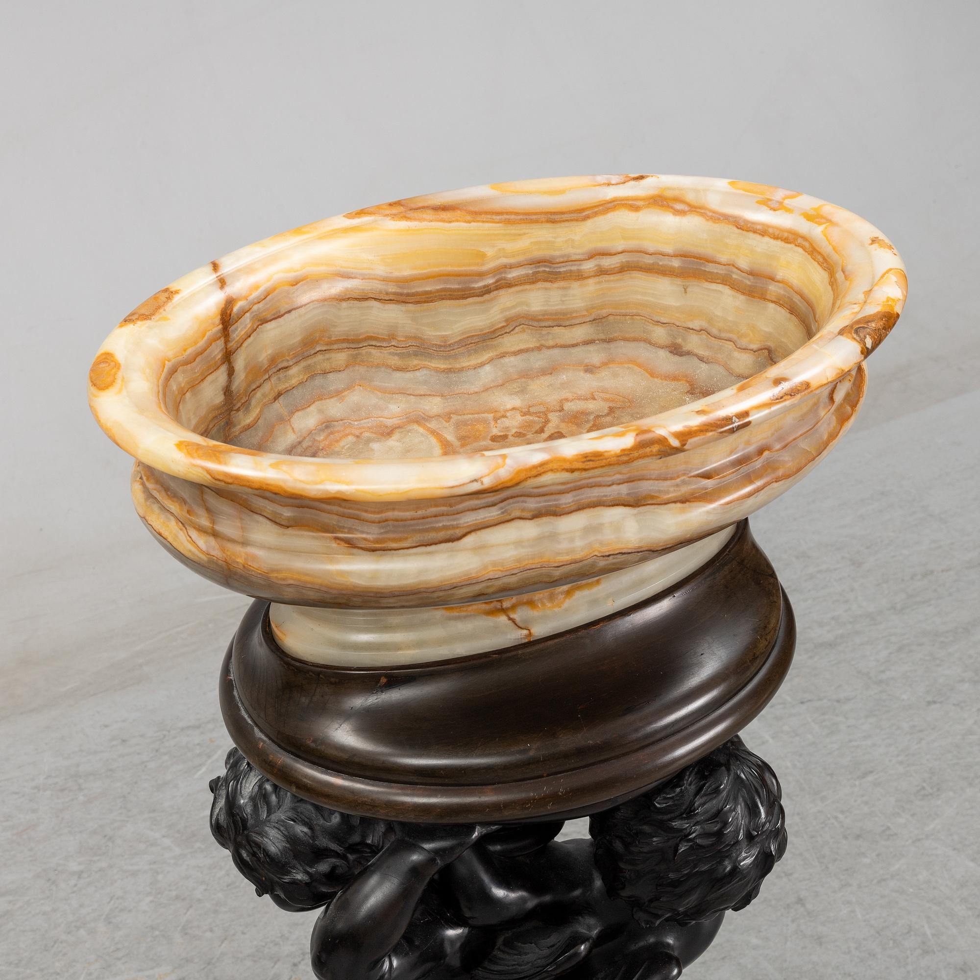 A wooden pedestal with onyx bowl, 20th Century.