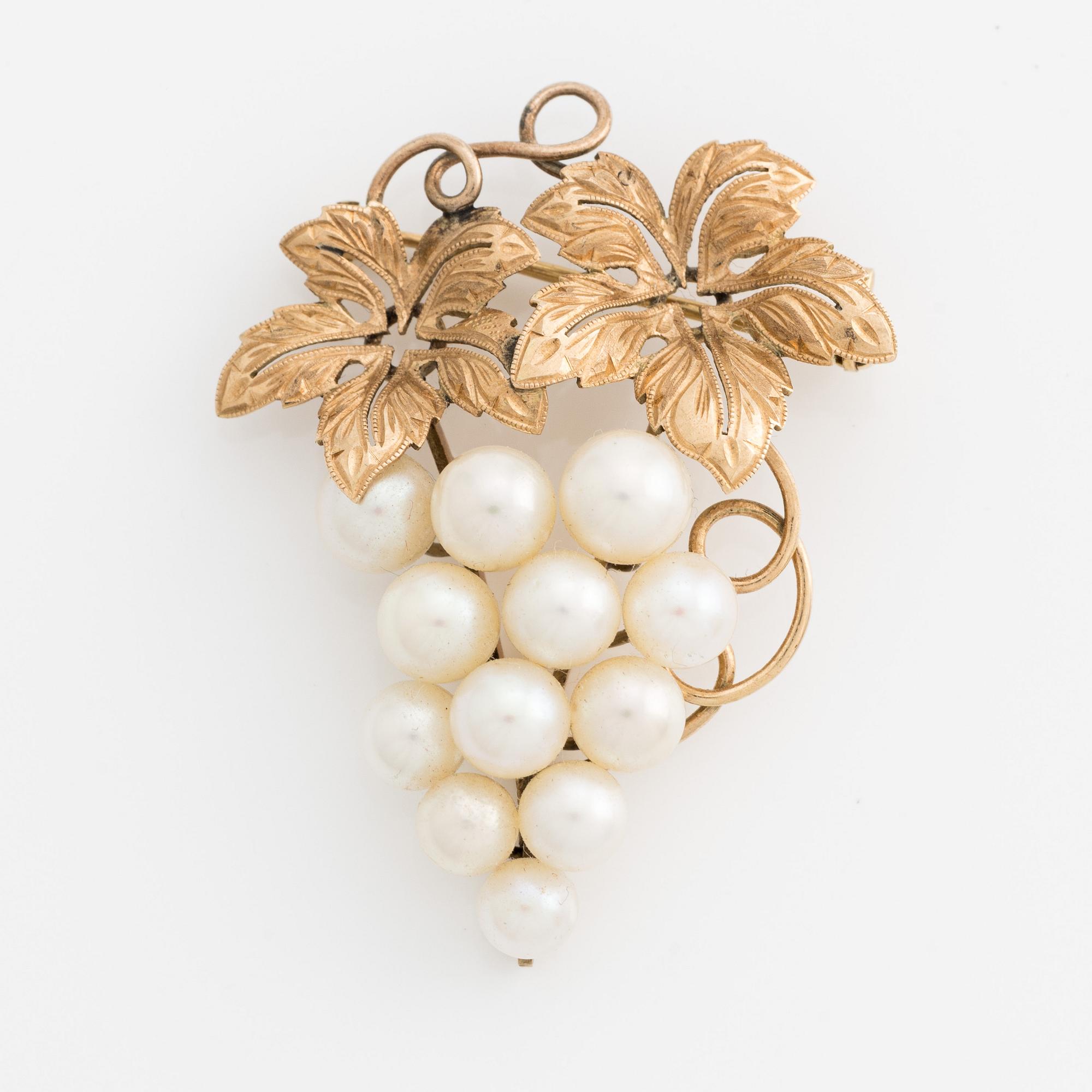 Brosch, guld med pärlor i form av druvklase.
