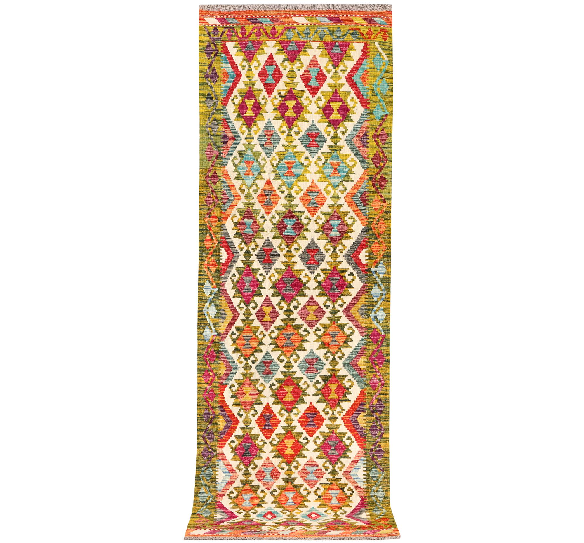 An Afghan kilim rug, c. 246 x 80 cm.