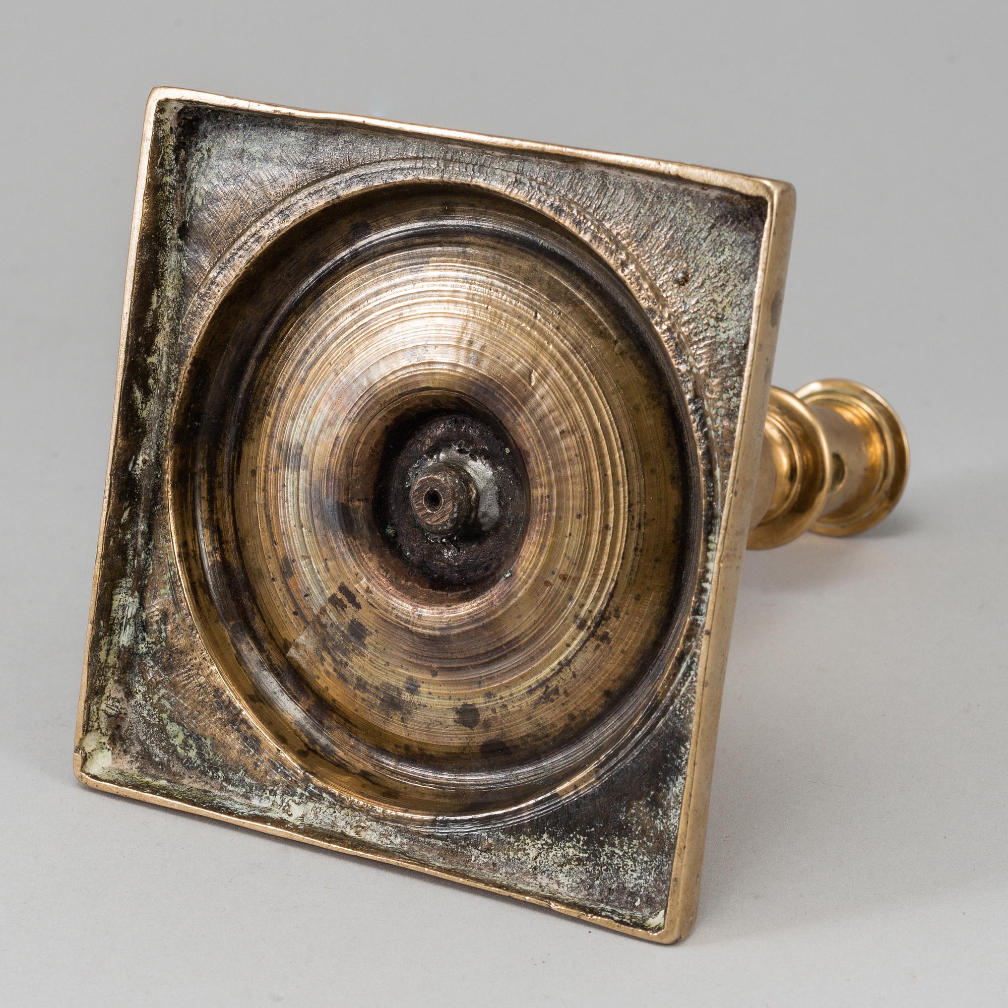 A 17th century bronze candlestick.