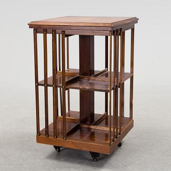 A swivel bookshelf veneered with mahogany from the second half of the 20th century.