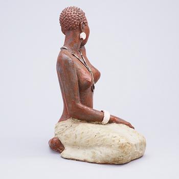A Michael Schilkin stoneware sculpture of a woman, Arabia, Finland, 1940's.