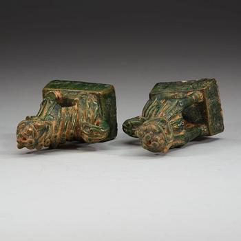 A pair of green glazed joss stick holders, Ming dynasty (1368-1644).