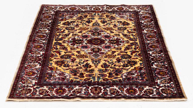 A semi-antique oriental silk rug, signed, c 176 x 118 cm.