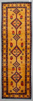 An oriental runner, ca 305 x 94 cm.