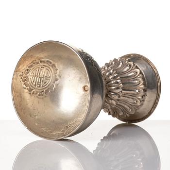 A Tibetan butter lamp, silvered copper, 20th century.