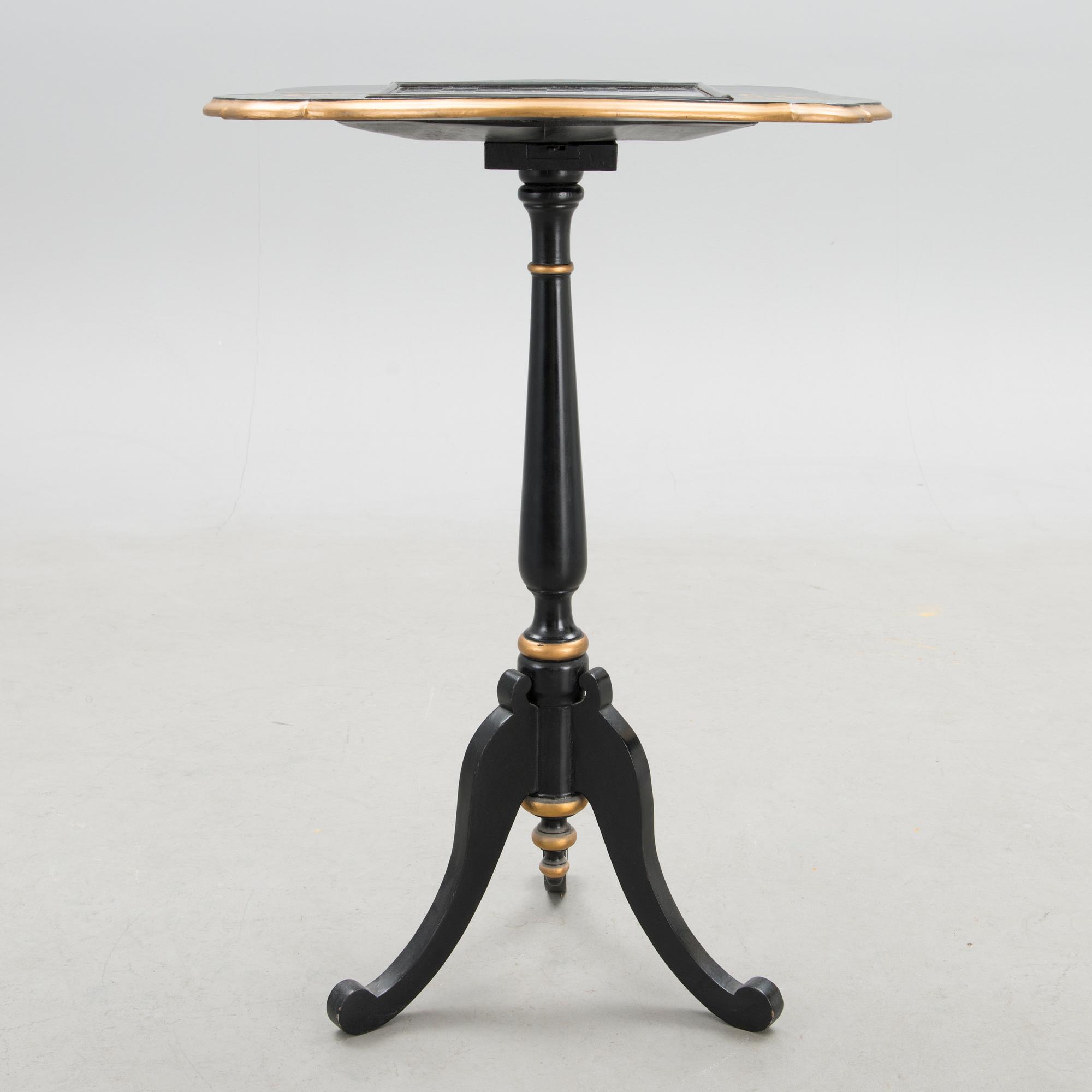 A Chinese tilt top chess table from the first half of the 20th century.
