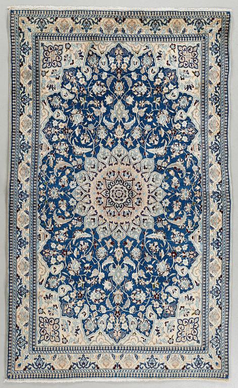 A Nain rug, part silk, 183 x 110 cm.