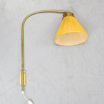 A model 2484 brass wall light by Josef Frank for Firma Svenskt Tenn.