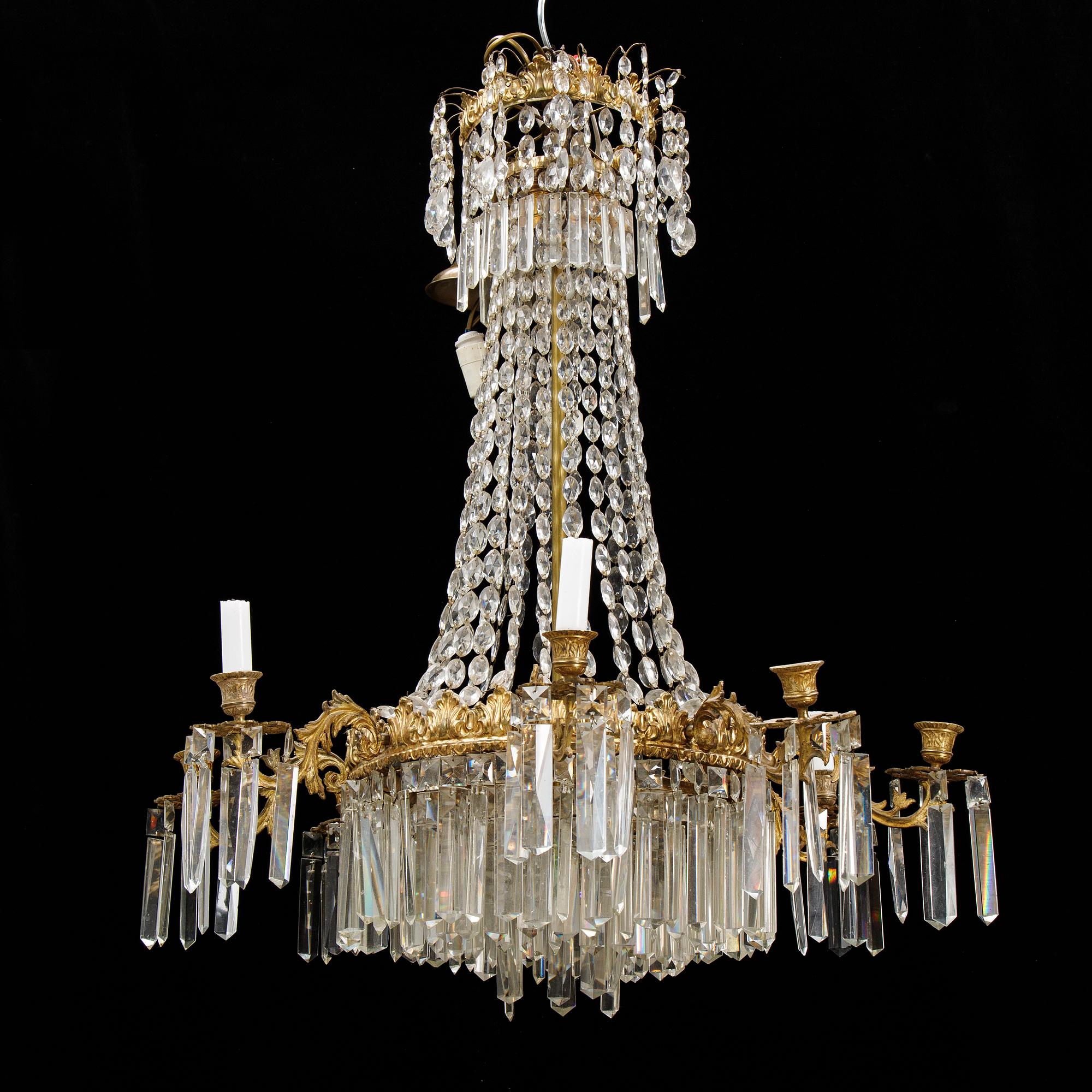 An Oscarian gilt brass eight-light chandelier.