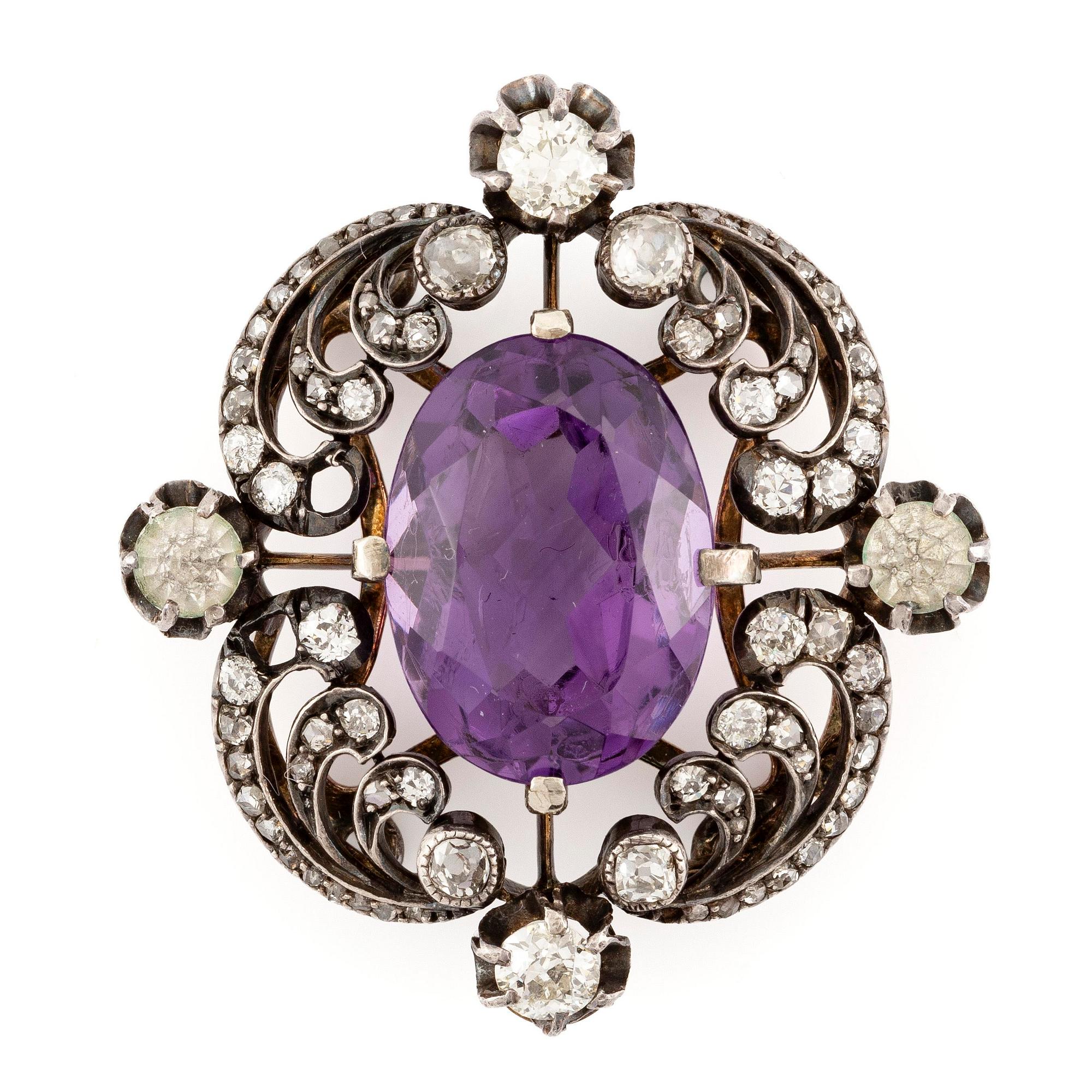A brooch/part of a tiara with a faceted amethyst and old- and rose-cut diamonds.
