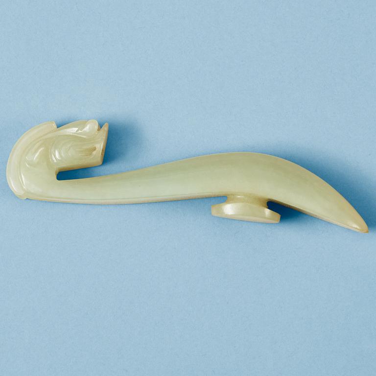A Chinese nephrite dragon shaped belt buckle.