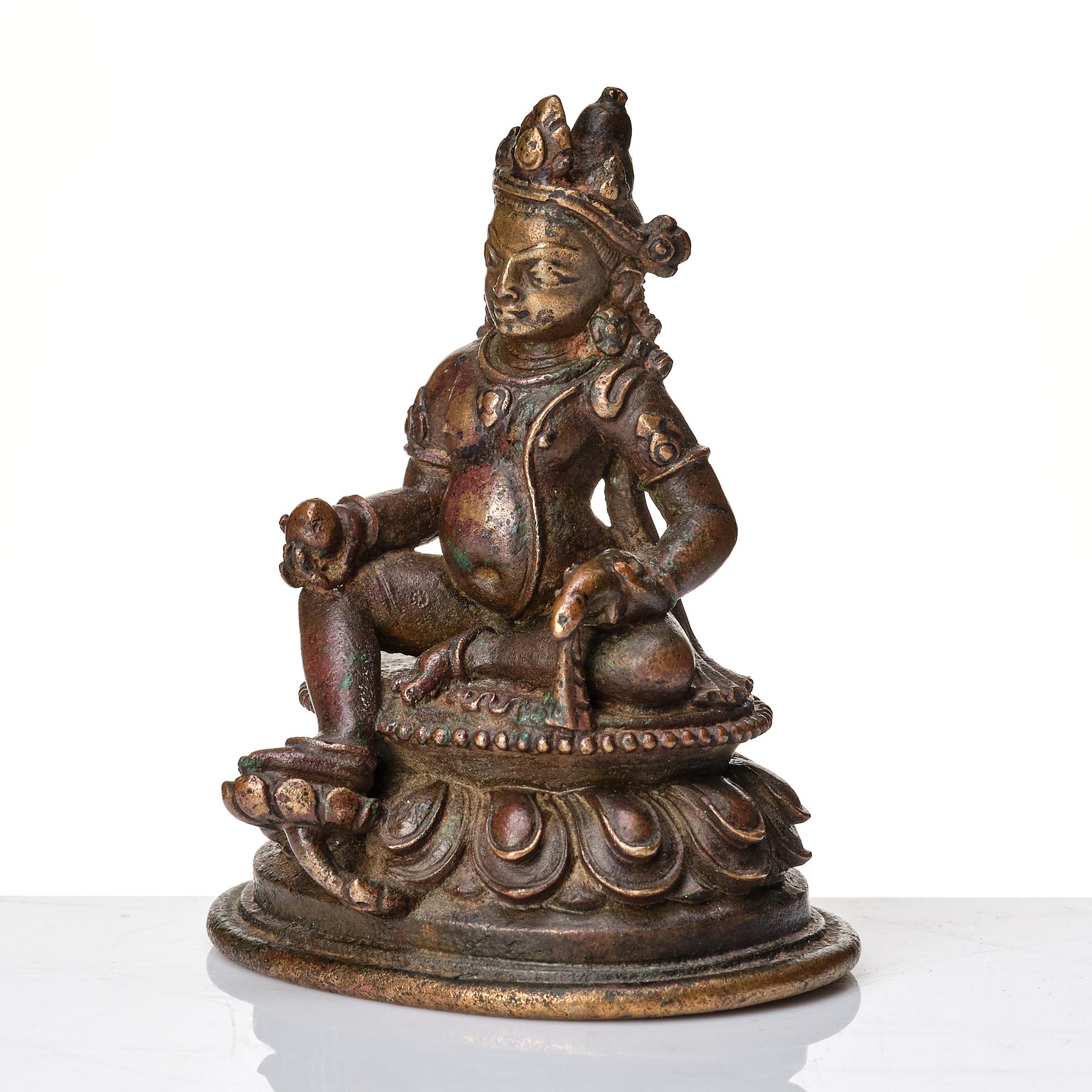 A copper alloy figure of Jambhala, Nepal, possibly 12/13th Century.