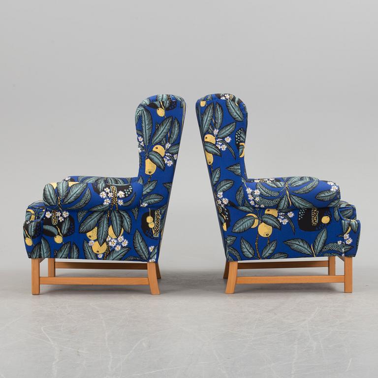 A pair of easychairs "Oxford", model 3543, by Ragnar Helsén for Firma Svenskt Tenn.