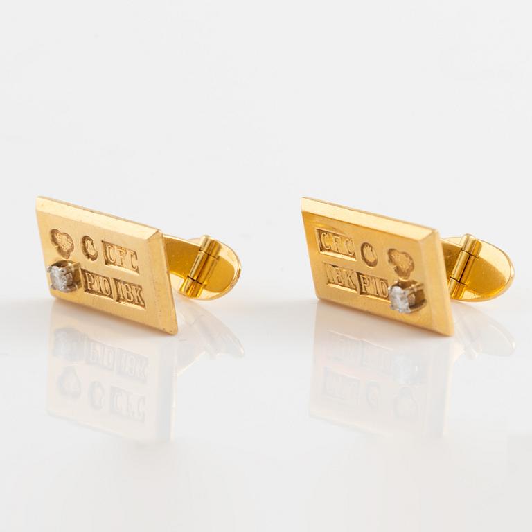 18K gold and brilliant cut diamond cufflinks.