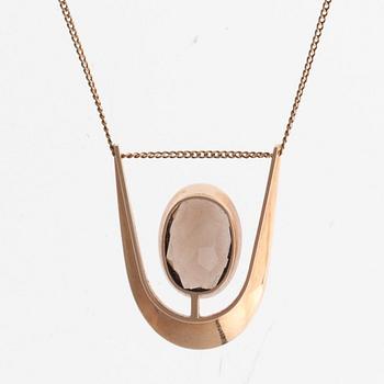 Eero Rislakki, A PENDANT, 14K gold, smoke quartz, N. Westerback 1962. Signed ER.