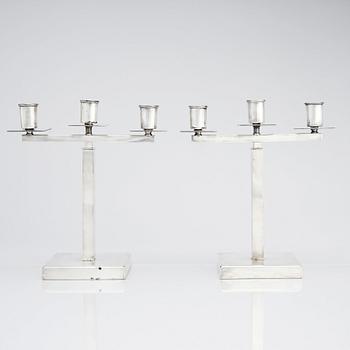 Rolf Engströmer, attributed to, a pair of silver plated candelabra, Fabriksaktiebolaget Kronsilver, Sweden 1930s.