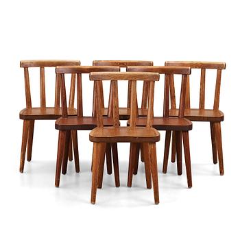 343. Axel Einar Hjorth, a set of six stained pine "Utö" chairs, Nordiska Kompaniet, 1930's.