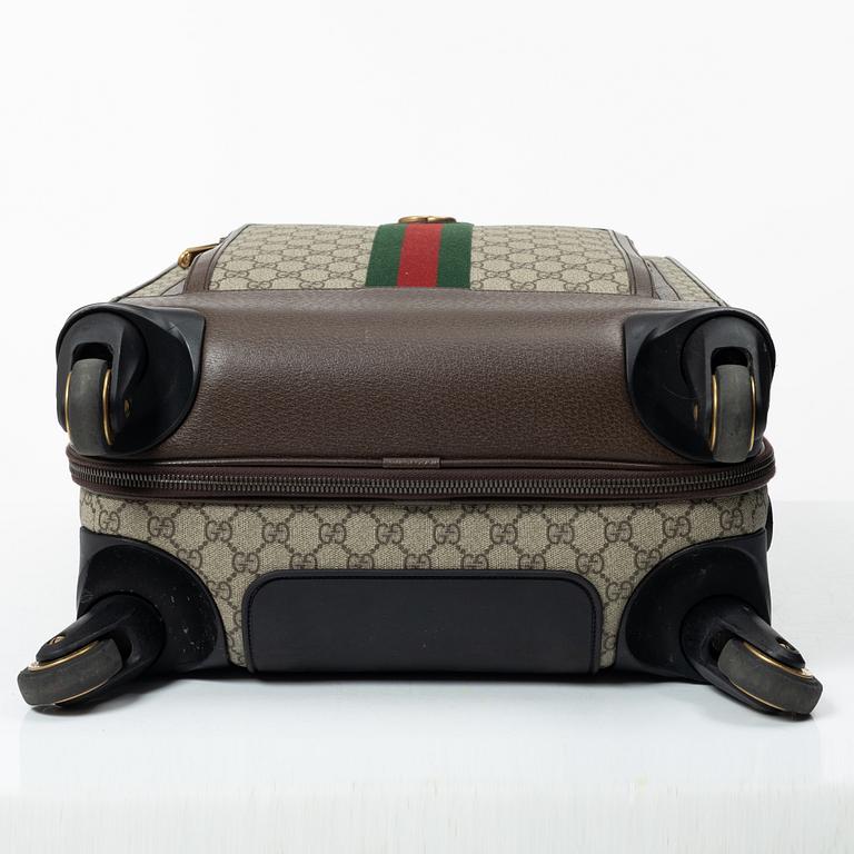 Gucci, suitcase / cabin bag.