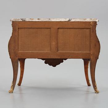 A Louis XV-style commode late 19th century.