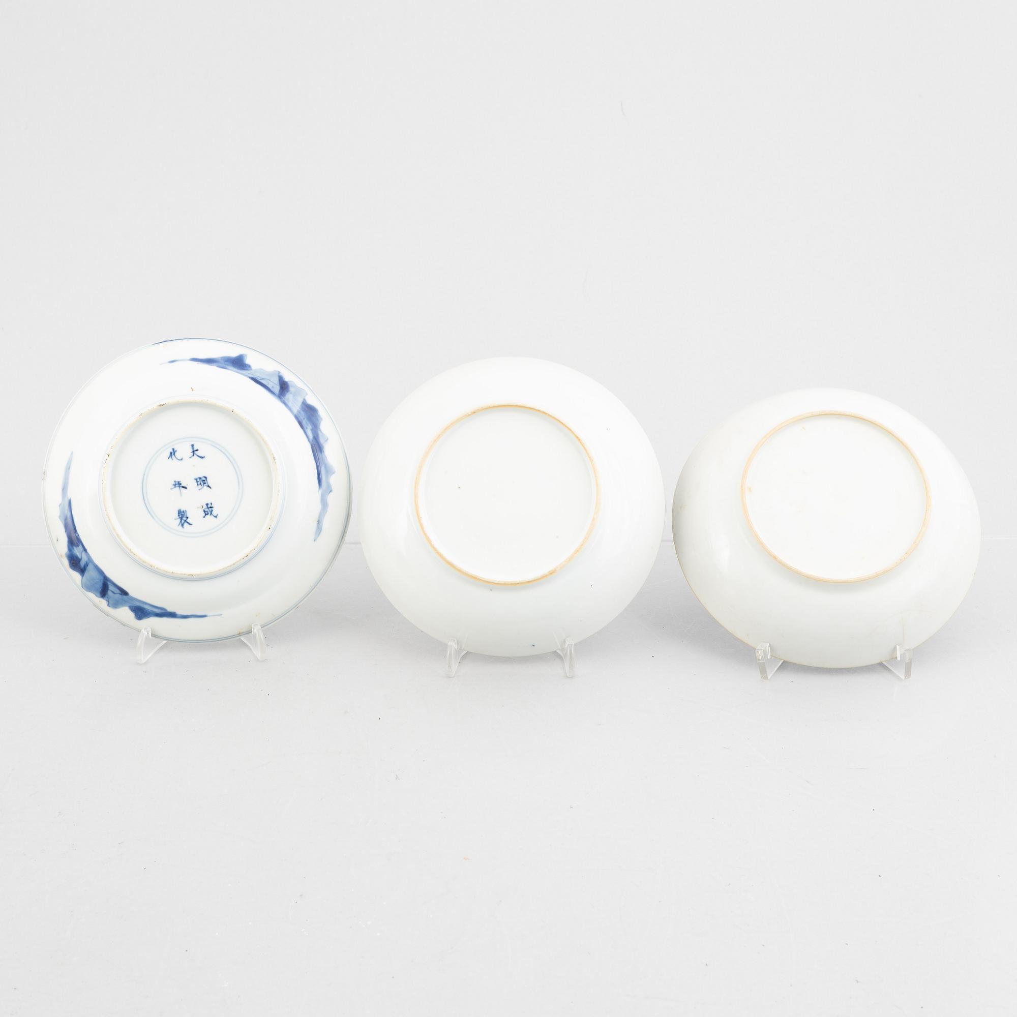 Three small porcelain plates and a cup with saucer, China, 18th century, and an English 19th century cup with saucer.