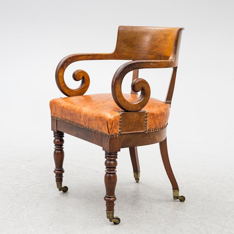 An Empire armchair, 19th century.