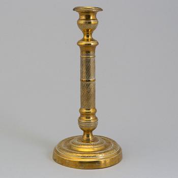 AN EMPIRE ORMOLU CANDLESTICK, first half of the 19th century.