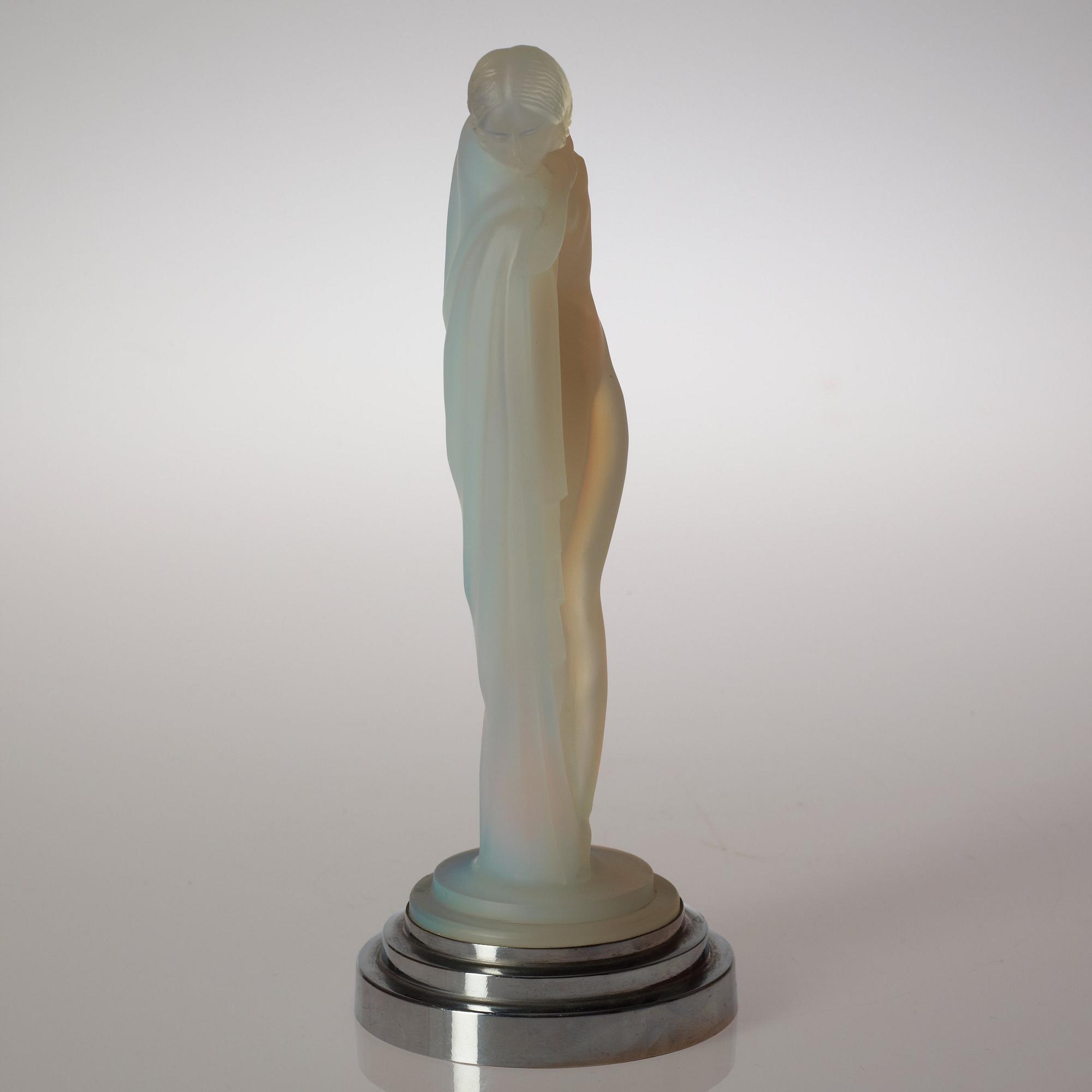 An Etling Art Deco opalescent mould-glass figure, Paris circa 1925.