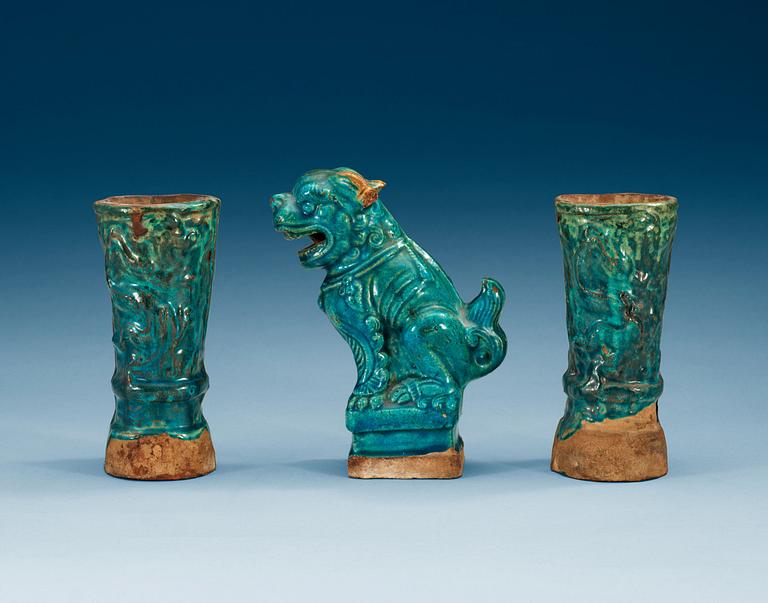 A set of two turquoise glazed altar vases and a Buddhist lion, Ming dynasty (1368-1644).