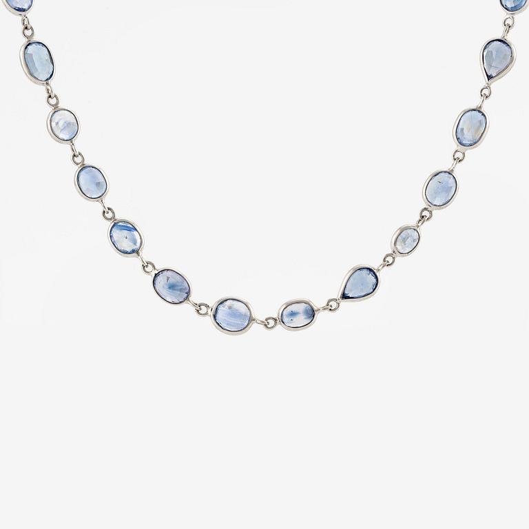 An 18K white gold necklace set  with faceted sapphires.