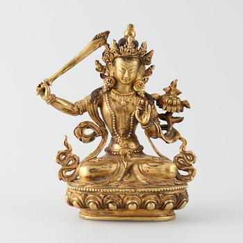 SKULPTUR, "Manjushri", förgylld metallegering, Tibet 1900-talets mitt.