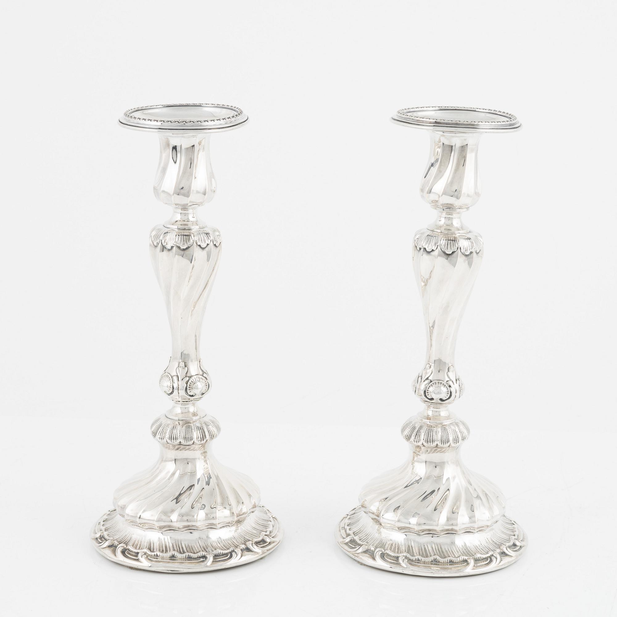 A pair of silver candle sticks by K Anderson Stockholm 1898.