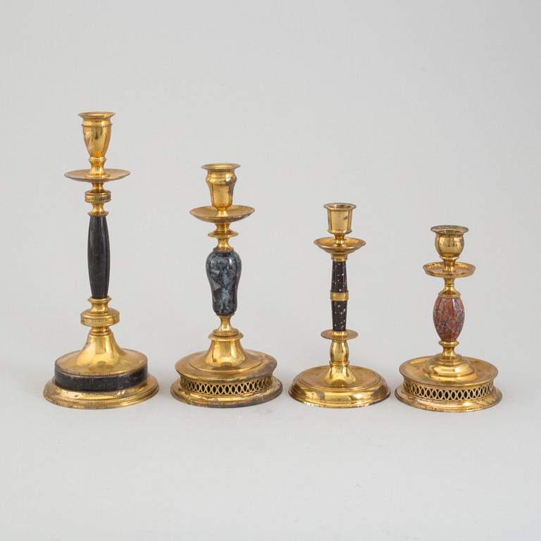 CARL HJALMAR NORRSTRÖM, four brass and stone candlesticks from Skultuna, numbered 073/300, 1997.