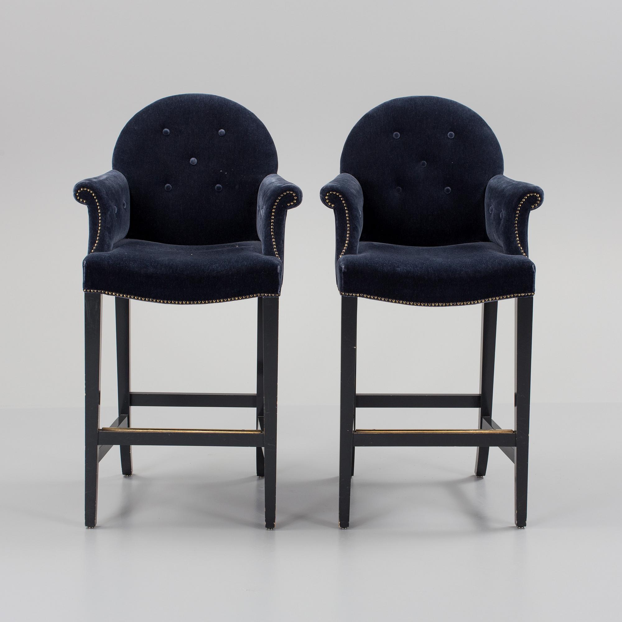 A pair of "The Simplified Moonback Counter Height Stool" barstools by Soane Britain.