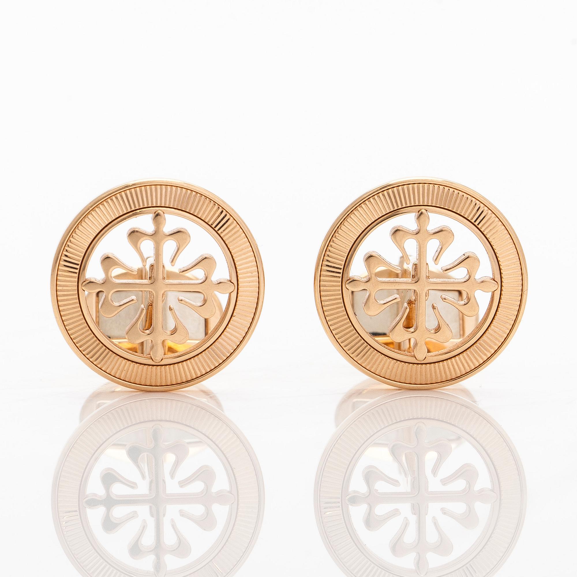 Patek Philippe, a pair of 18K gold "Calatrava" cufflinks.