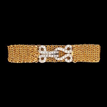 947. A gold and diamond clasp bracelet, turn of century 1900.
