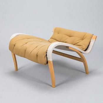 Bruno Mathsson, A "Pernilla" armchair with footstool, for DUX, designed in 1944.