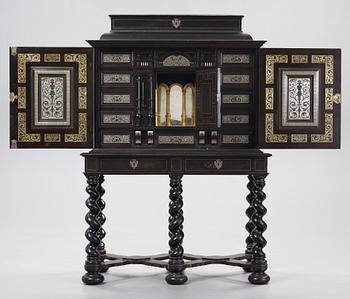 A Baroque-style circa 1900 cabinet on stand.